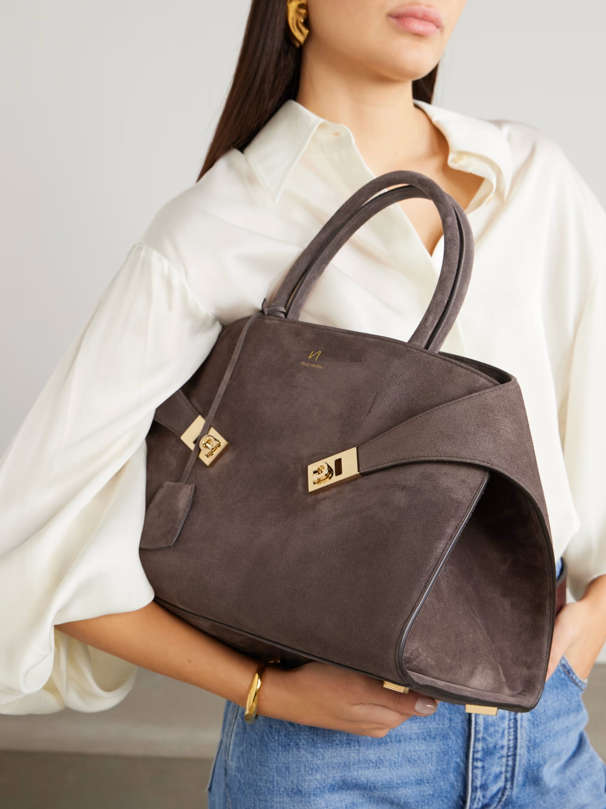 Brown suede leather handbag with gold strap by Nikkar